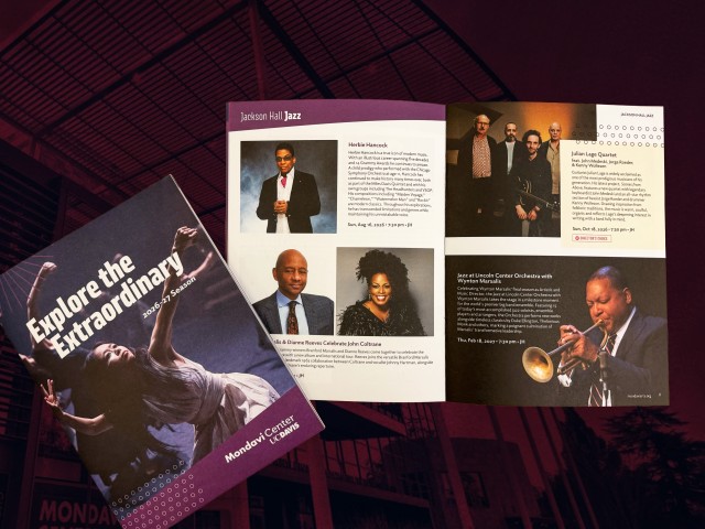 Printed purple brochure open to artist headshots, short bios, and a trumpeter photo