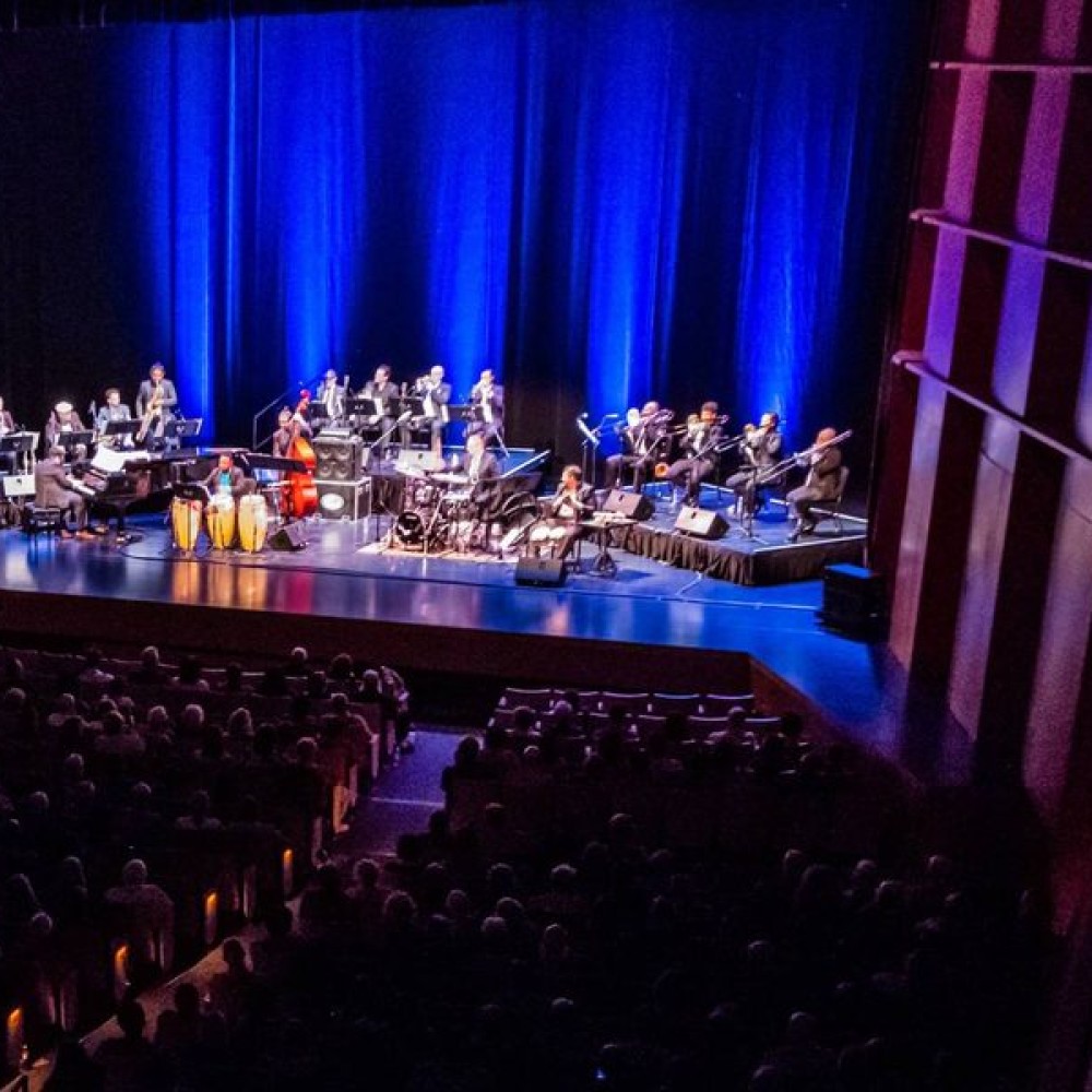 Arturo O'Farrill performance in darkened auditorium.