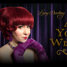 Vintage poster of coy red-haired woman in purple gloves before a purple velvet curtain with the text "Lucy Darling As You Wish" overlaid on top.