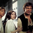 A film still of Luke Skywalker, Princess Lei, and Han Solo