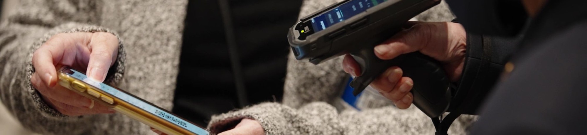 Usher scans a mobile ticket on someones phone