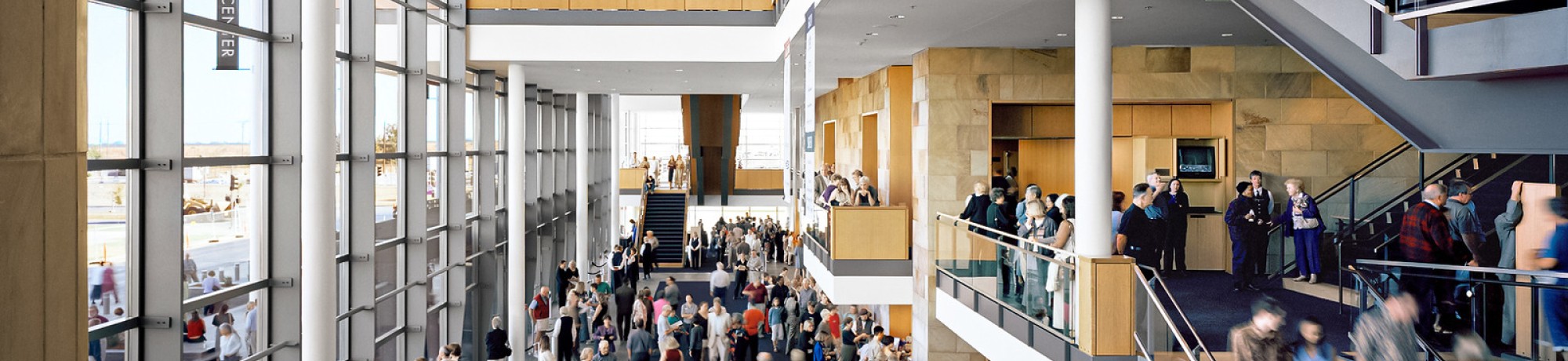 Busy modern Mondavi Center lobby with crowds on multiple levels (photo)
